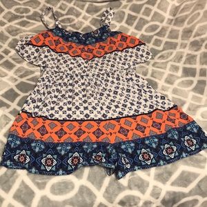 A white,navy,and coral romper.